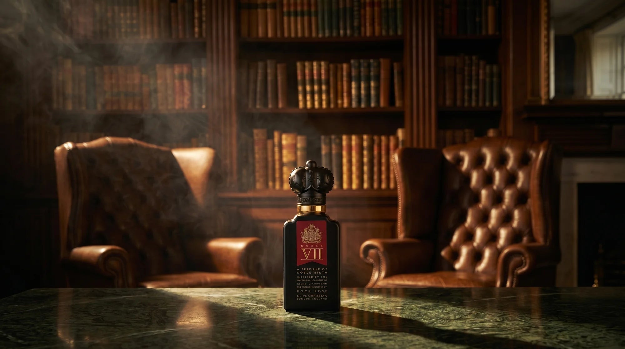 Clive Christian Rock Rose bottle on green marble in a dim private library